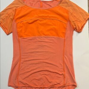 Lululemon athletica Vibrant Orange Short Sleeve Top with open back